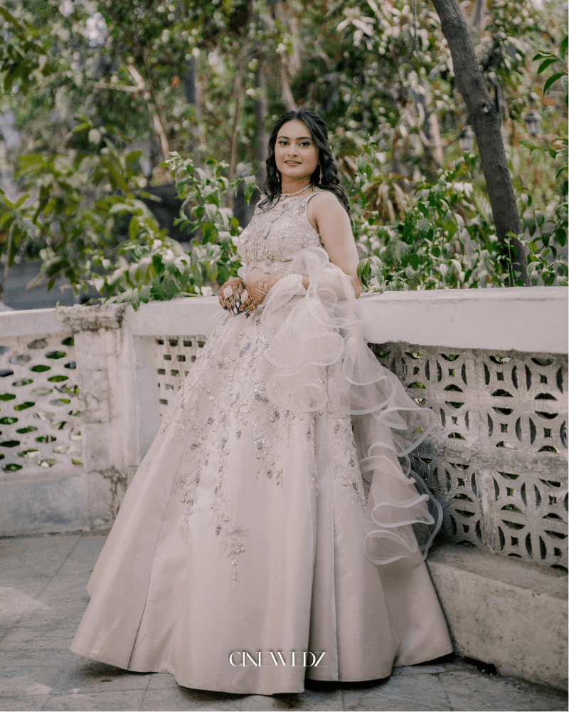 Designer bridal reception gown in beige color by Radharani Vastralaya Ahmedabad