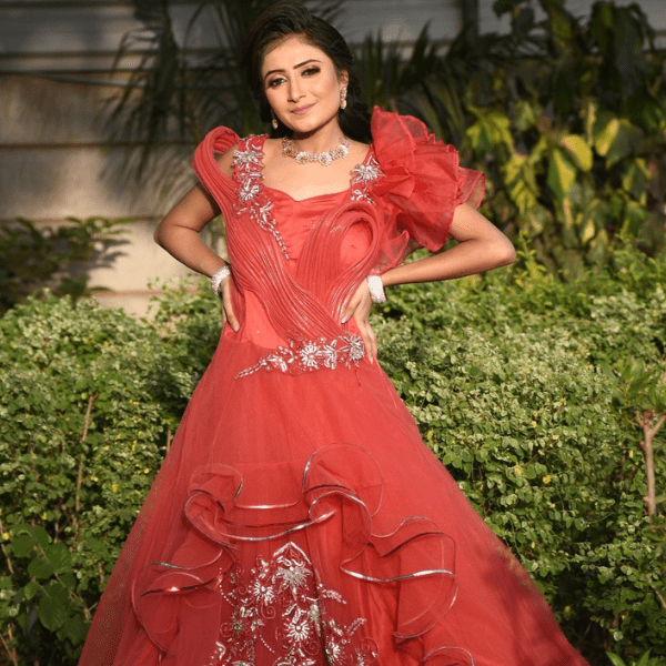Red designer reception gown for women with ruffle sleeves and heavy embroidery - Radharani Vastralaya