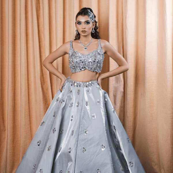 Woman wearing silver grey lehenga choli with sequin embroidery designer party wear ethnic outfit