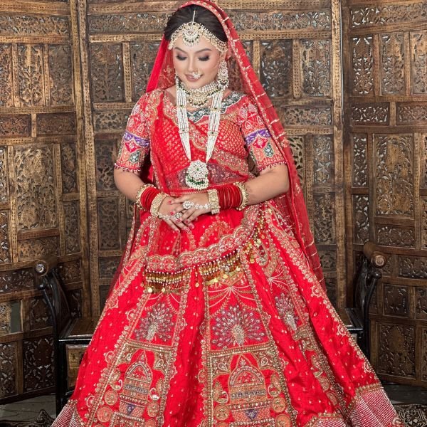 Traditional red bridal panetar lehenga with heavy zari embroidery and bridal jewelry - Radharani Vastralaya